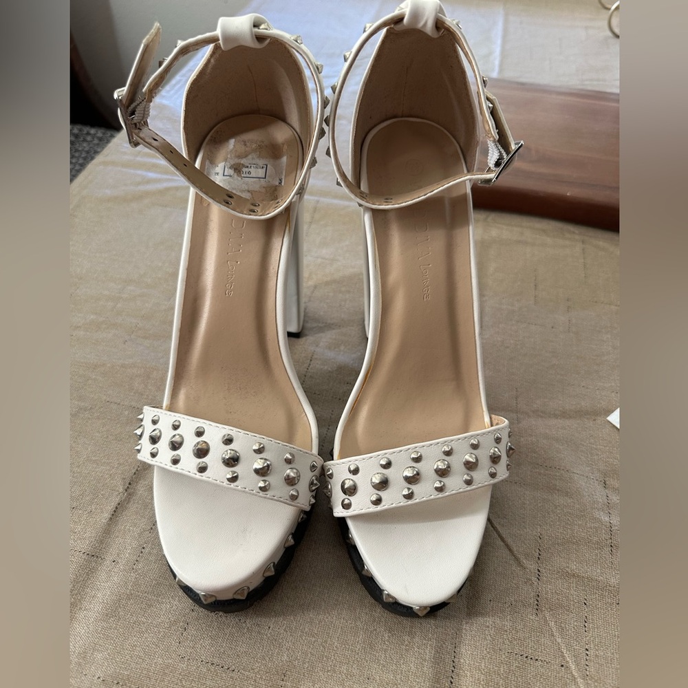 Fun white high heels with silver studs. Wild Diva Lounge.